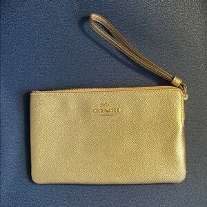Metallic gold Coach wristlet